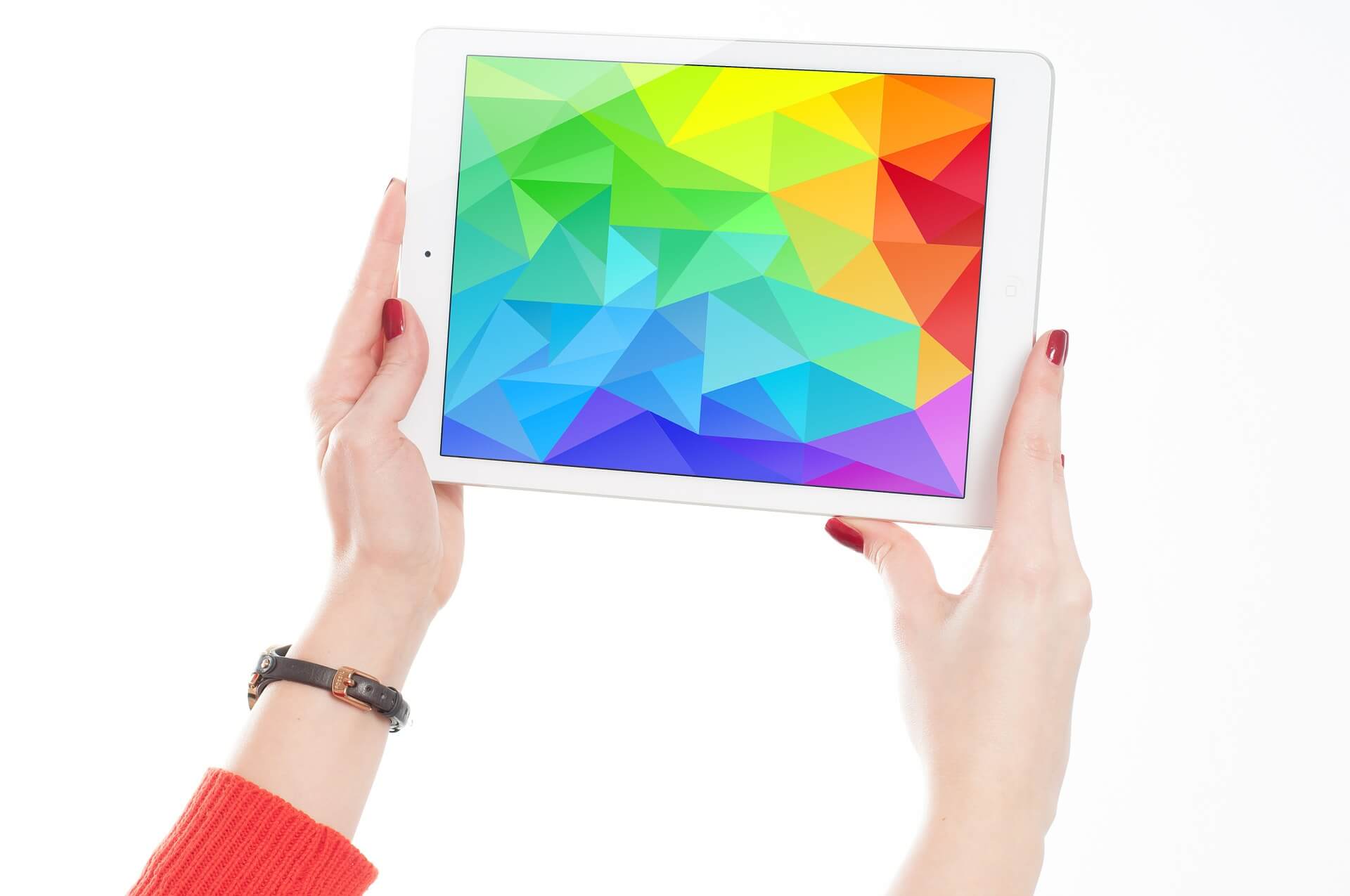 hands holding tablet