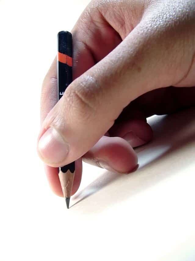 hand holding pencil