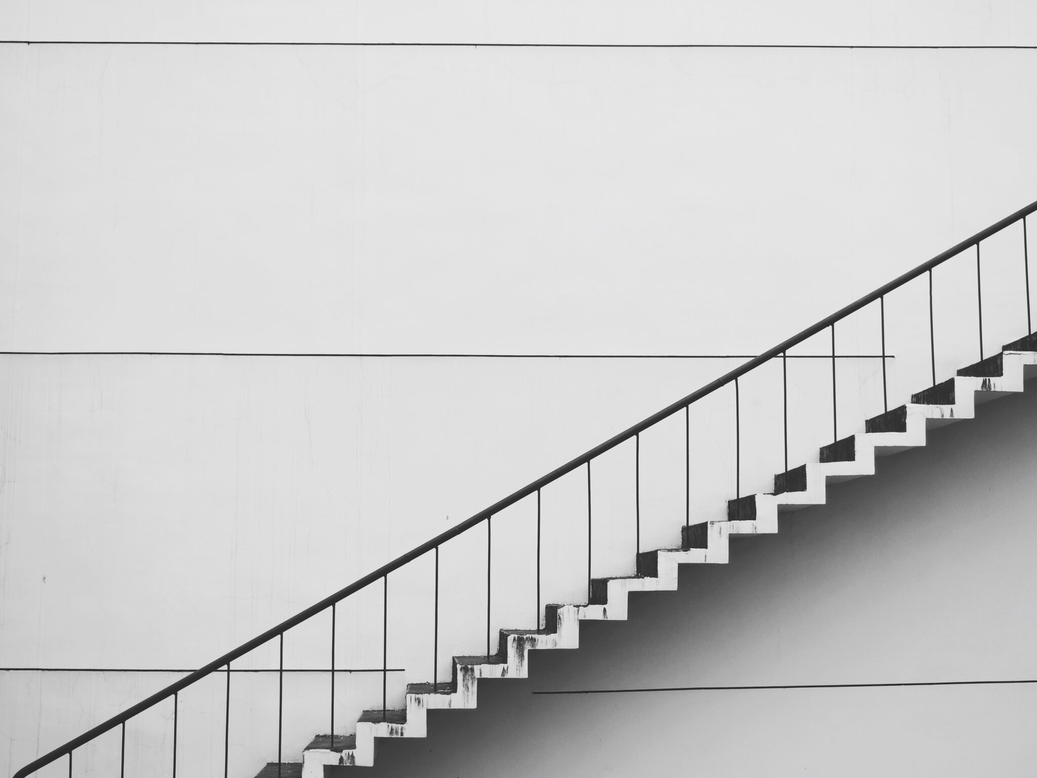 floating staircase against a white wall