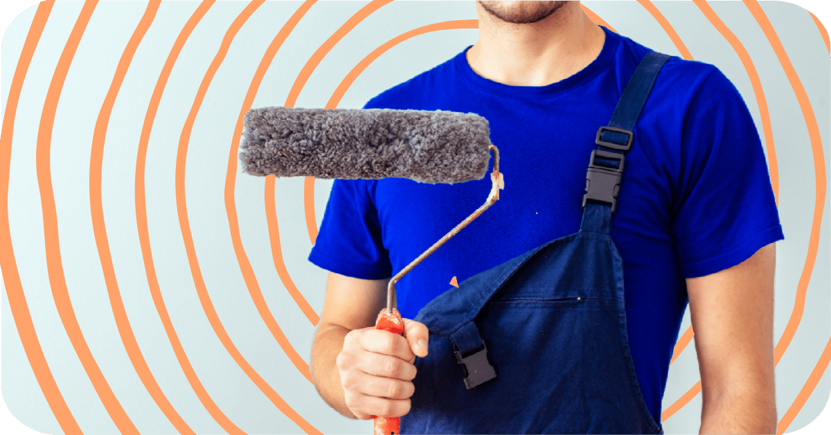 photo of man holding paint roller